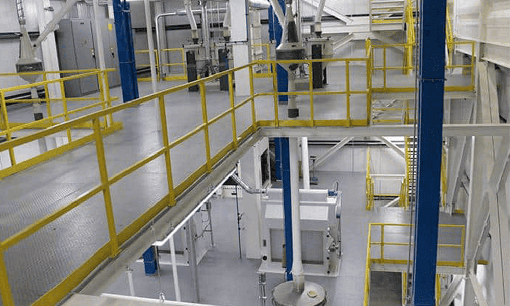 High-capacity dairy processing equipment with safety railings and automation for efficient milk production